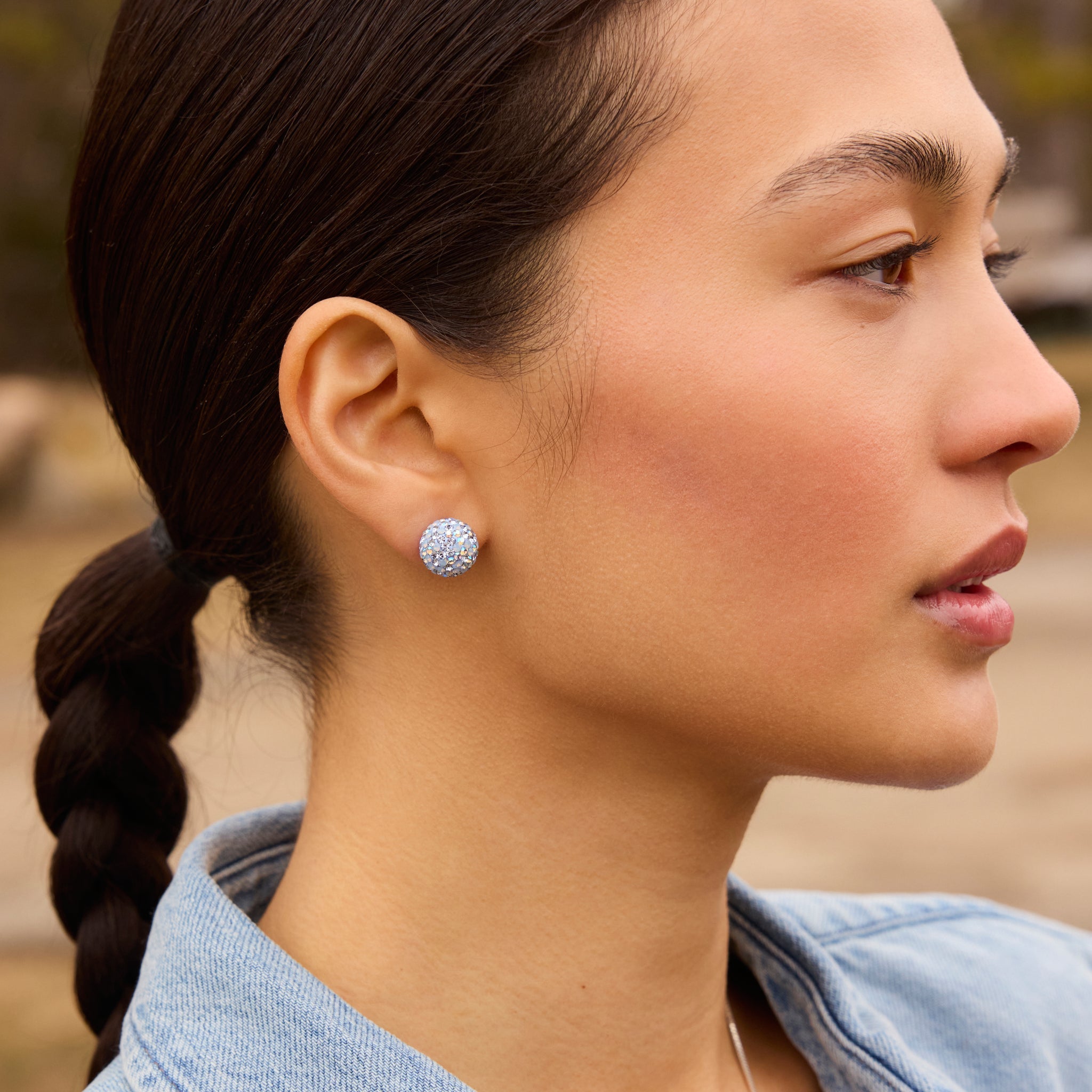 Large Denim Sparkle Ball™ Stud Earrings on model