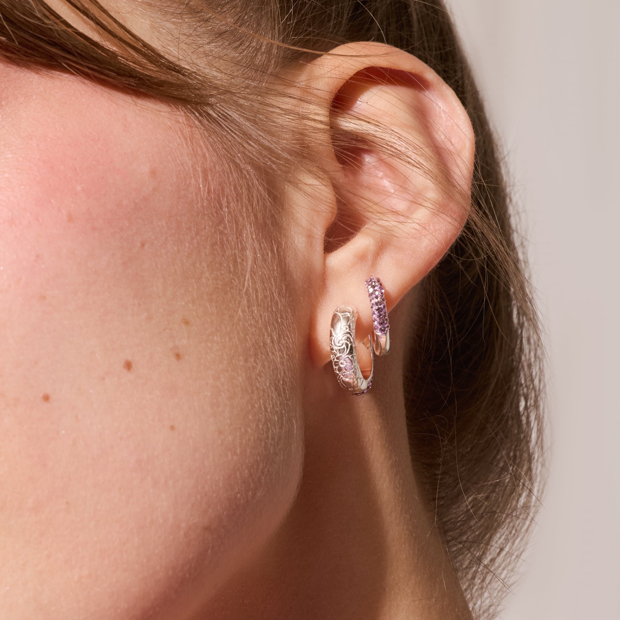 Lilac Sparkle Reversible Hoop Earrings Etched Floral side on model