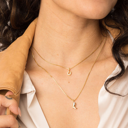 Mini Horseshoe Charm on model