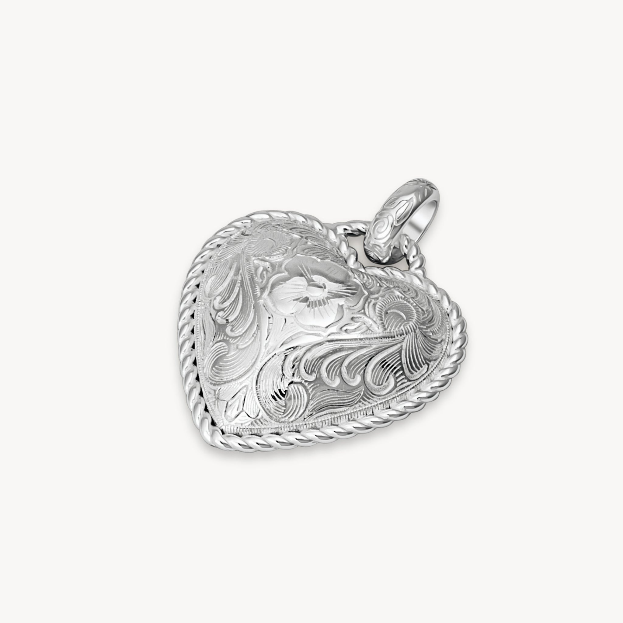 Etched Floral Heart Charm laying flat
