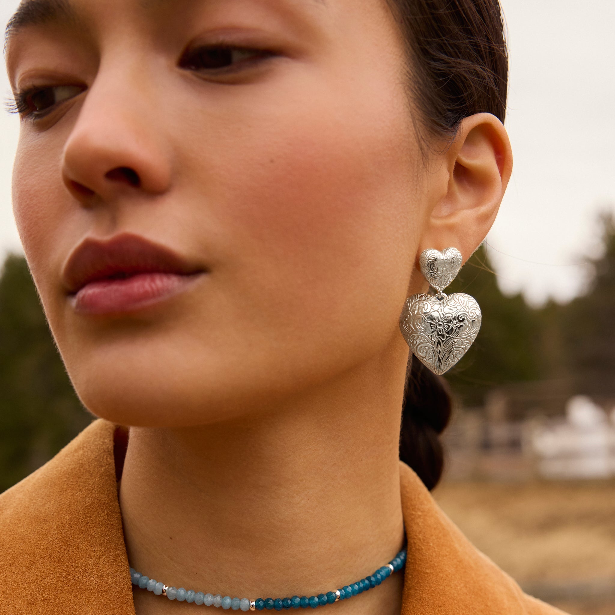 Etched Floral Statement Earrings on model