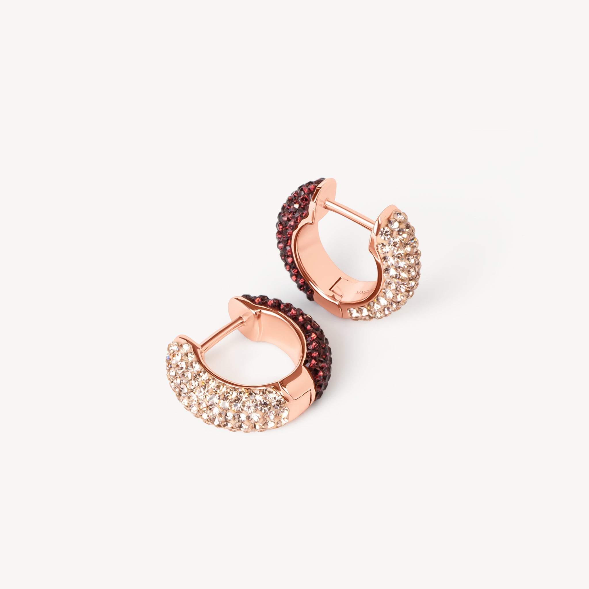 Merlot & Rose Gold Reversible Sparkle Hoop Earrings laying flat