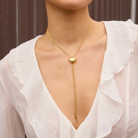 Gold Puffy Heart Bolo Tie on model