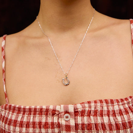 Reversible Horseshoe Charm on model