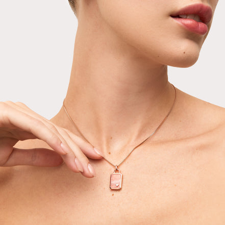 Rhodocrosite Tag Charm on model