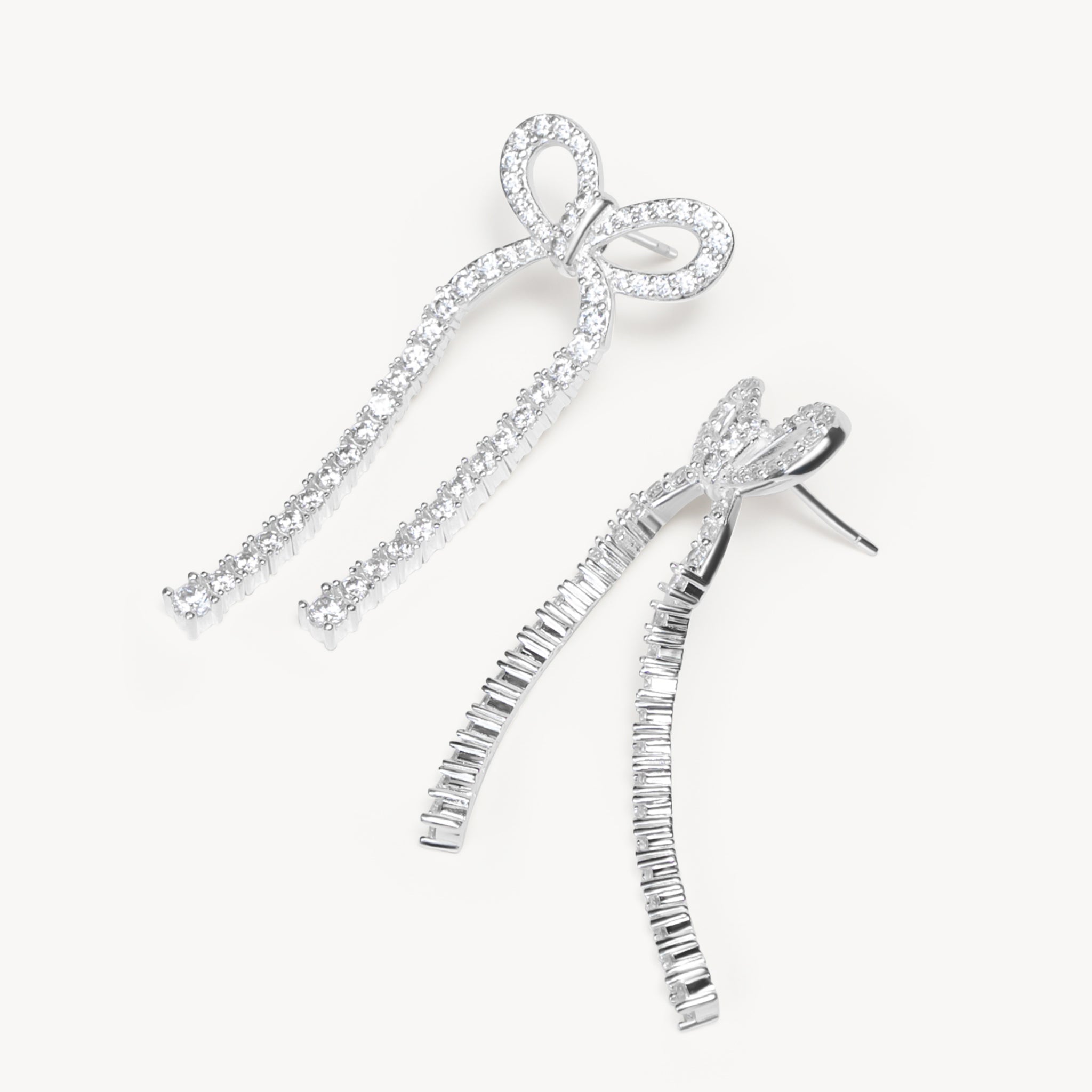 Tennis Bow Statement Earrings laying flat