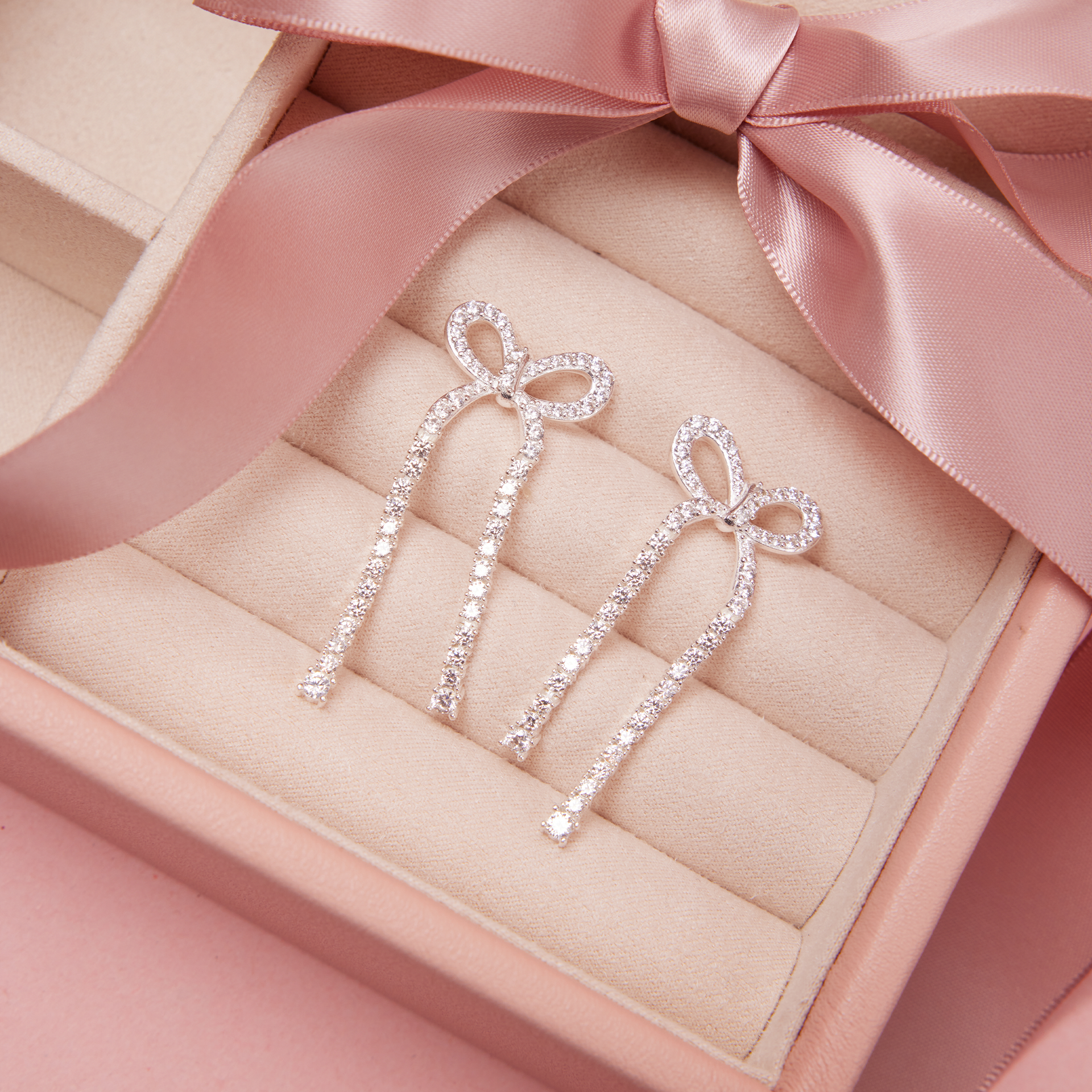 Tennis Bow Statement Earrings in case