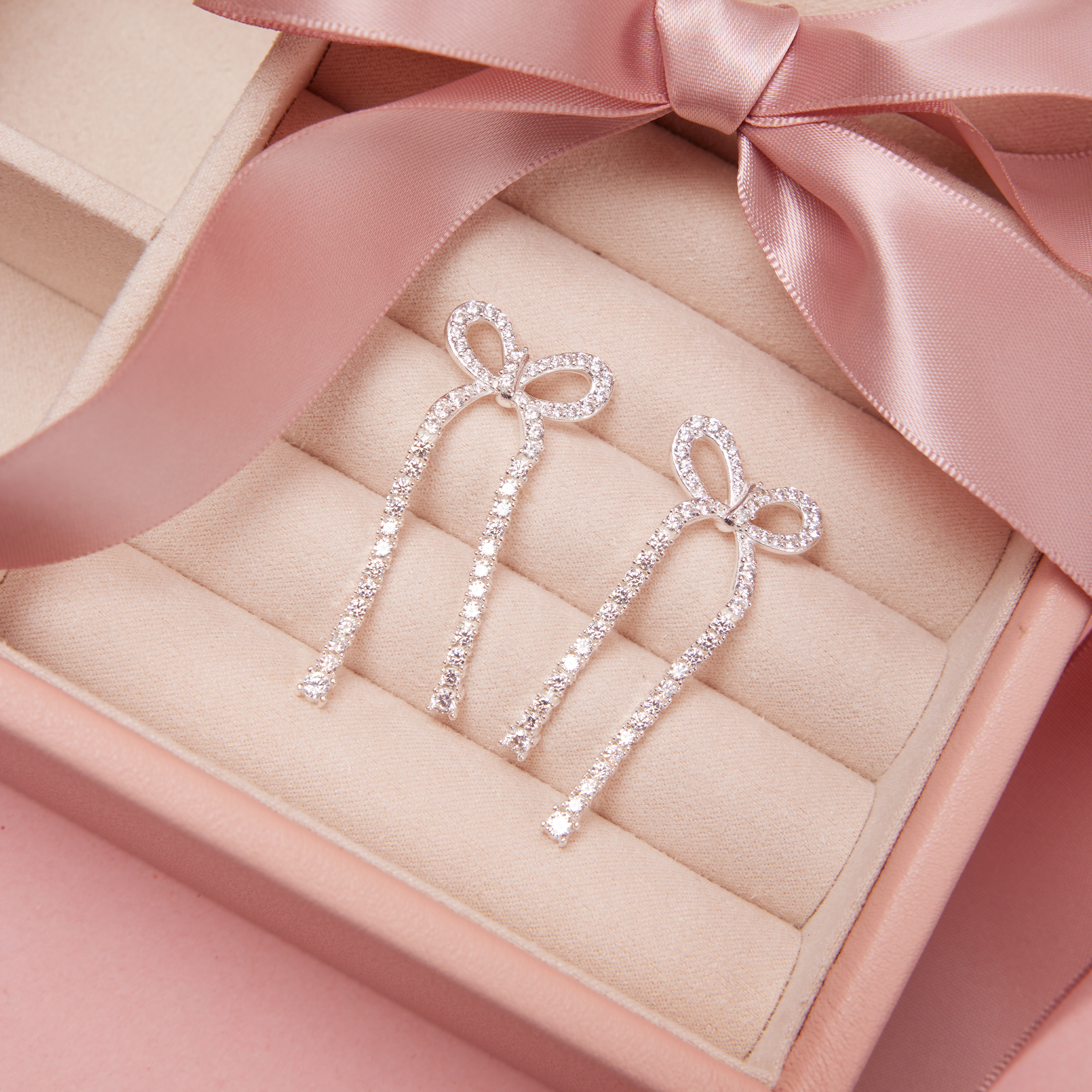Tennis Bow Statement Earrings in case