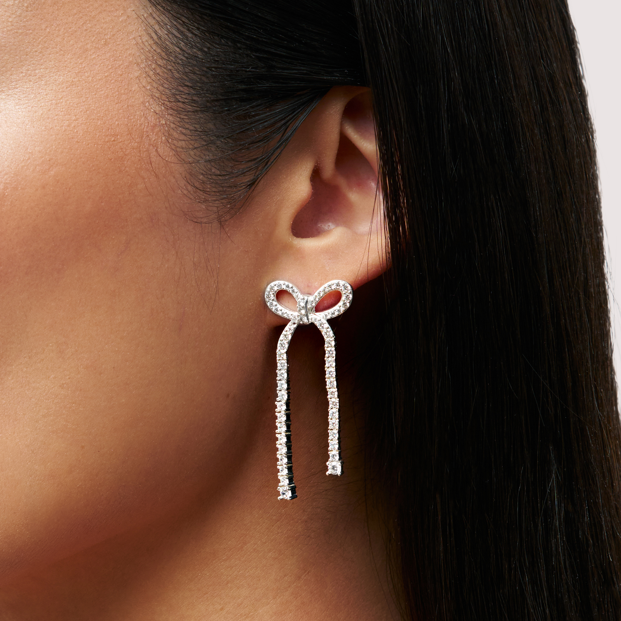 Tennis Bow Statement Earrings close up