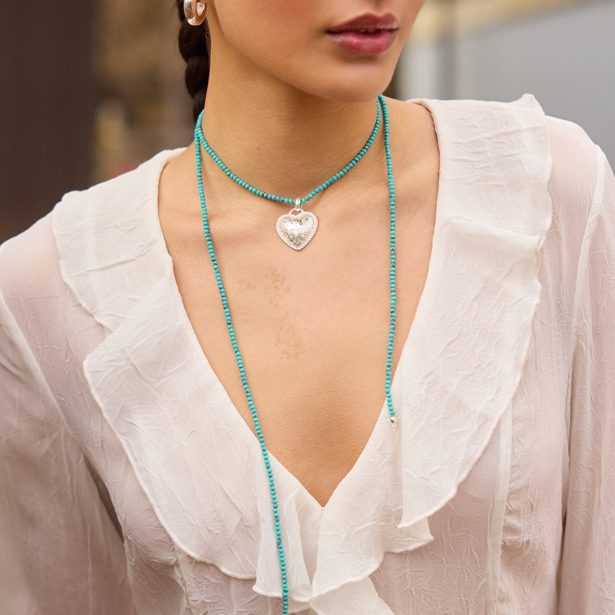 Etched Floral Heart Charm and Turquoise Lariat Necklace on model