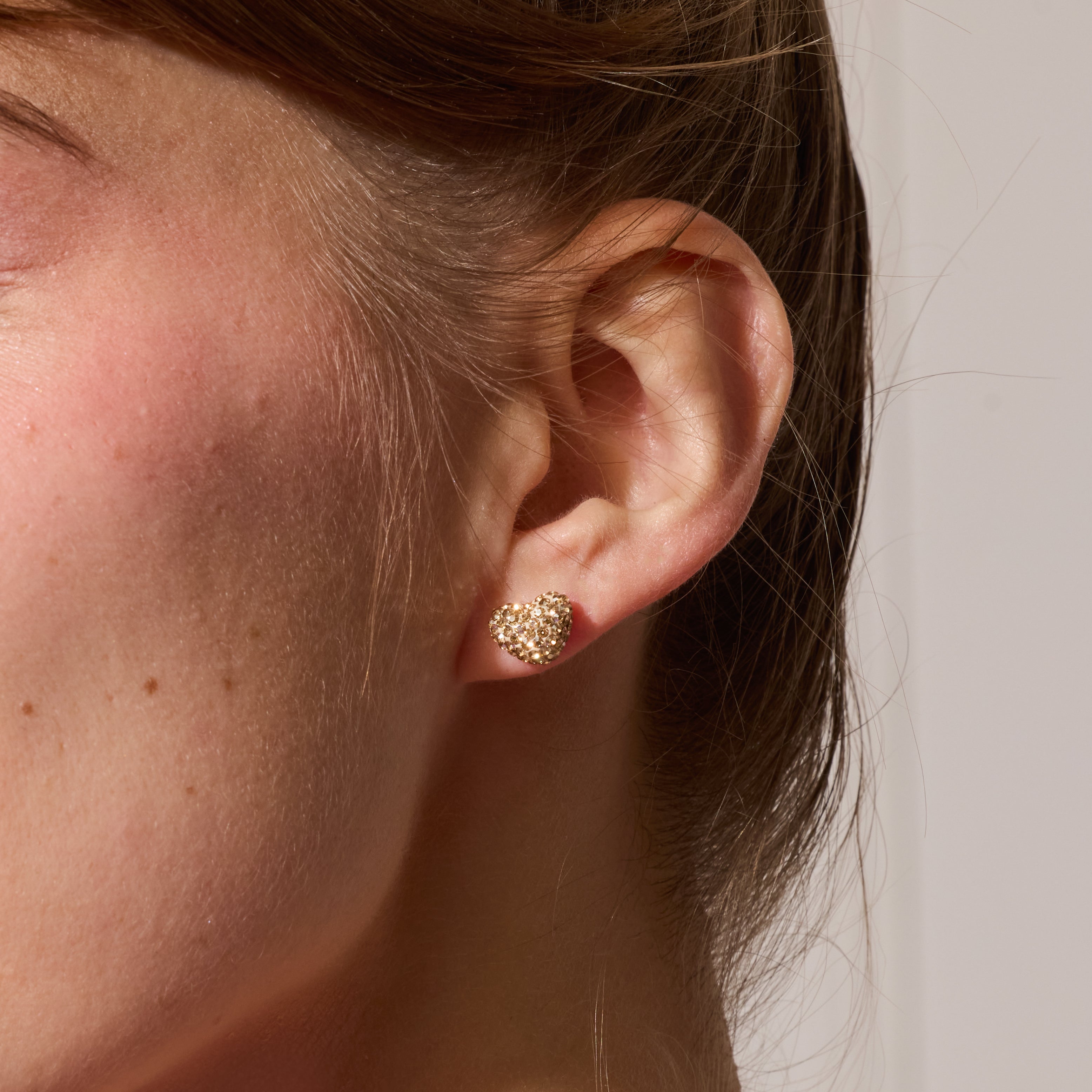 Sparkle Heart Stud Earrings Soft Gold on model