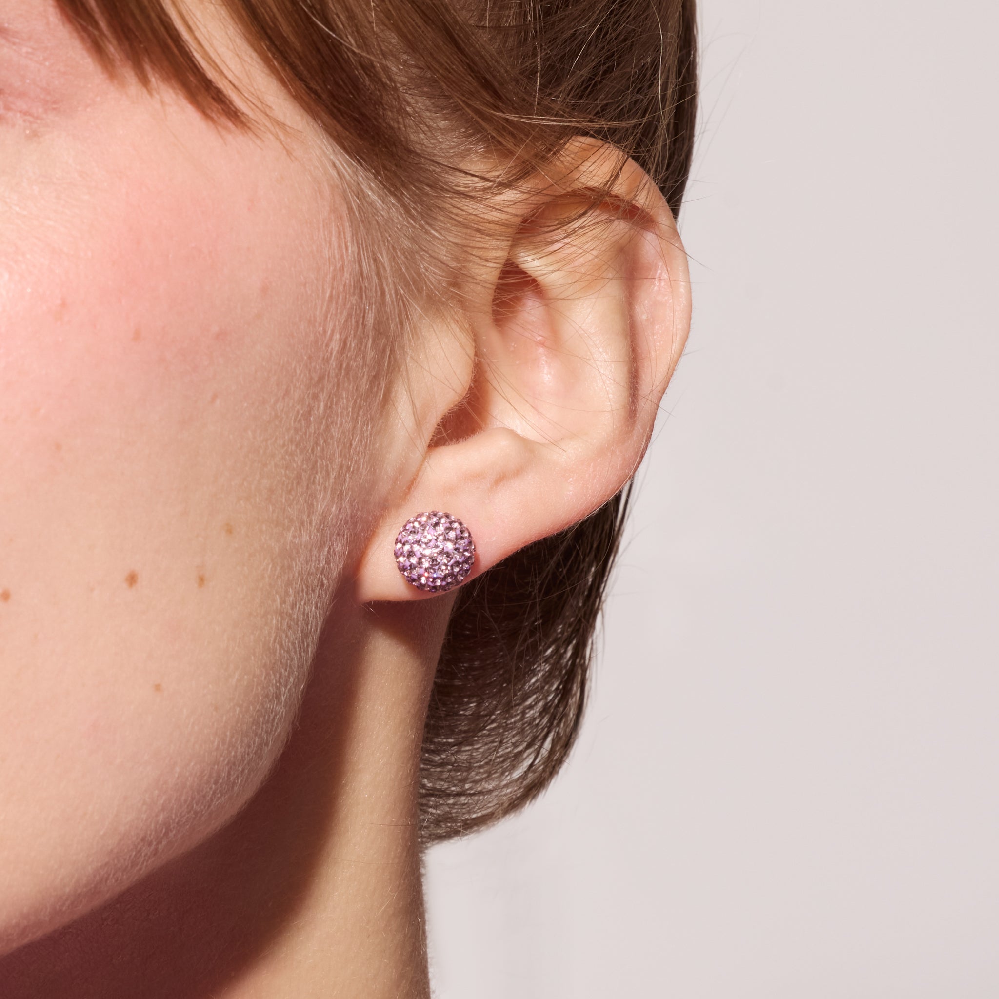 Medium Lilac Sparkle Ball™ Stud Earrings on model