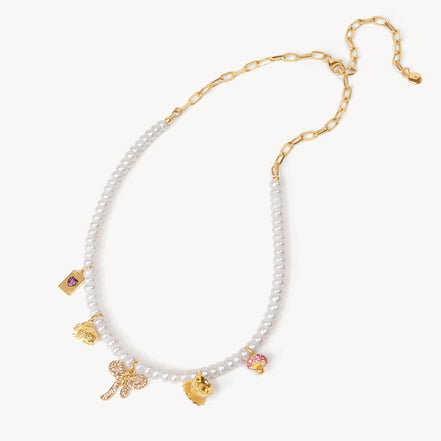 Alice-Inspired Charm Necklace laying flat