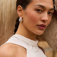 White Dream Puff™ Sparkle Stud Earrings on model