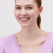 Heart Huggie Hoop Earrings Silver on model