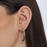 Rose Gold Medium Pavé Hoop Earrings and Rose Gold Large Hoop Earrings on model