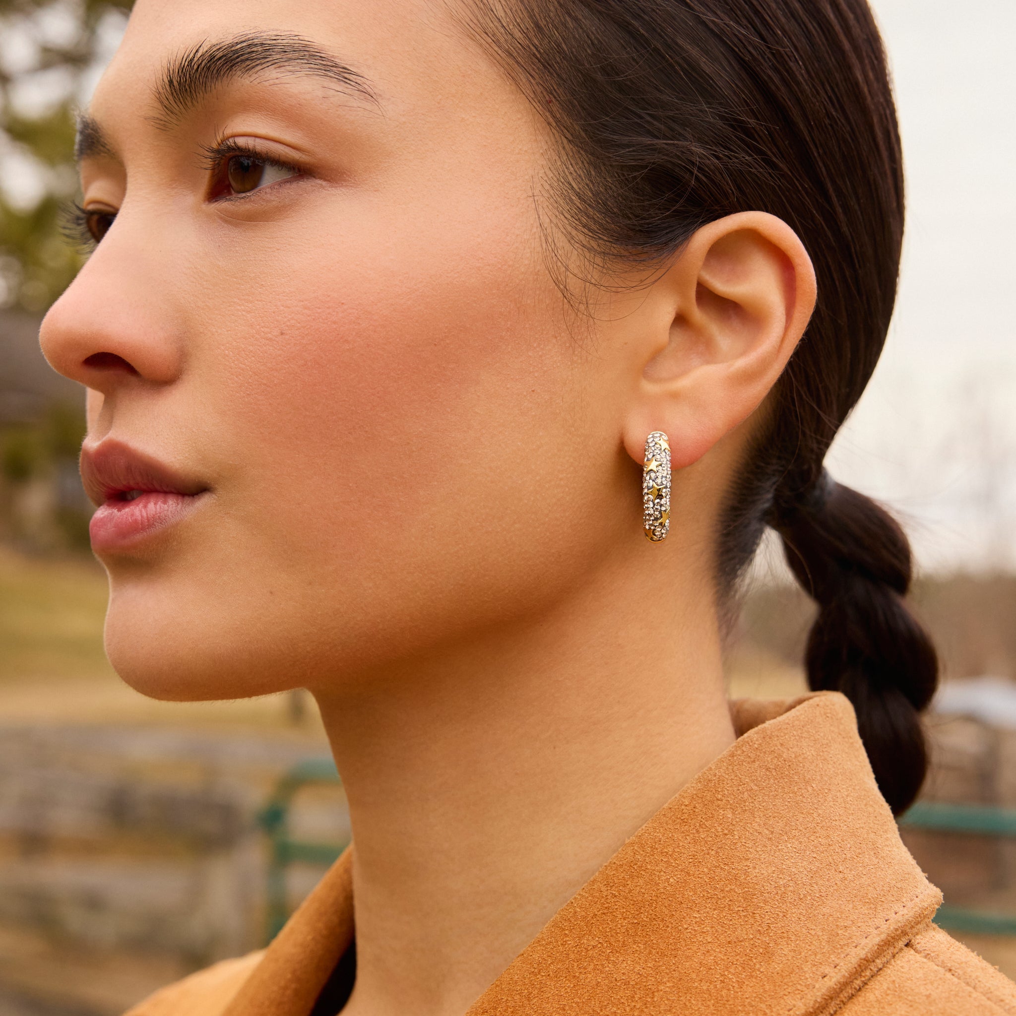 Silver Shade Star Studded Medium Sparkle Hoop Earrings on model