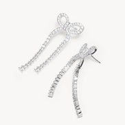 Tennis Bow Statement Earrings laying flat